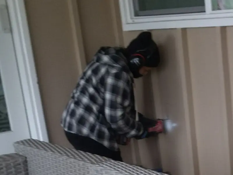 Professional electrician installing an exterior outlet in Upper Uwchlan